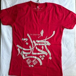 Brand new with tags Bright red tshirt “ Be Positive “